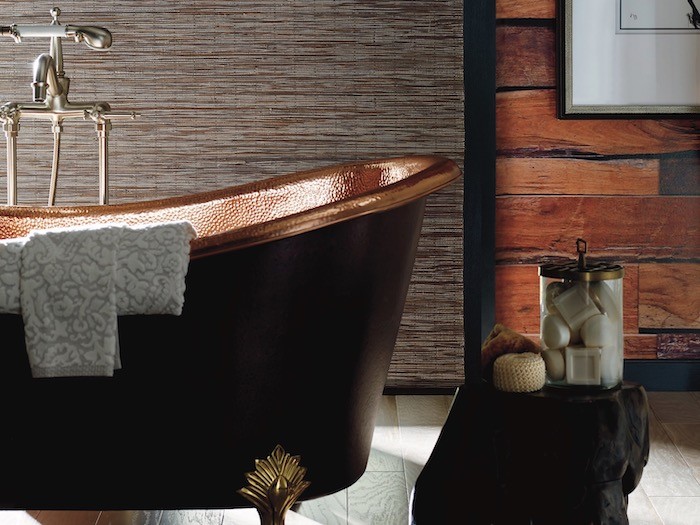 A bathroom with a refinished antique tub.